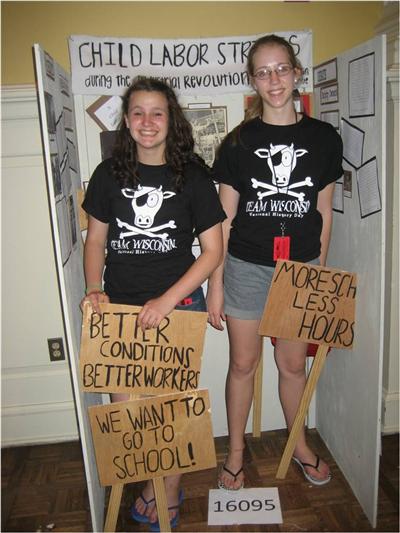 Caroline Crist and Katherine Stein with their group exhibit on Child Labor