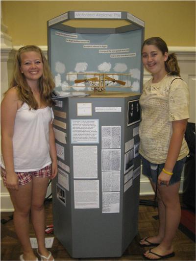 Nicole Tomter and Jordan Mason with their group exhibit on the Wright Brothers.